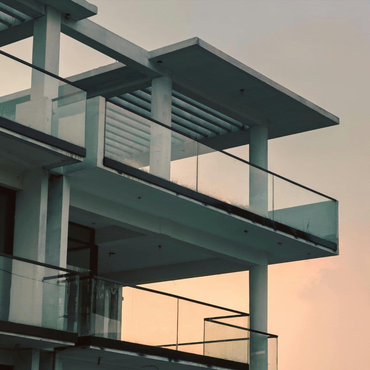 Glass railings on a balcony on a house facade